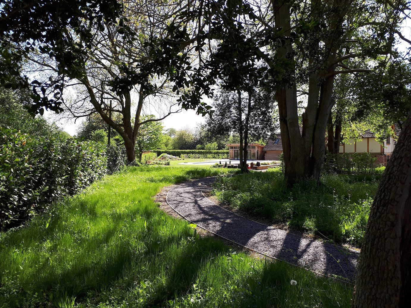 Garden design in Denham, Buckinghamshire with woodland area.