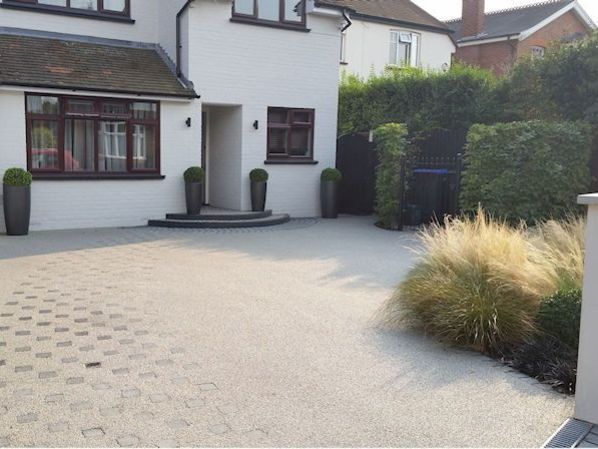 Front garden design in Woking Surrey with resin driveway
